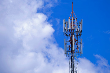 Telecommunication telephone signal transmission tower with beautiful blue sky background