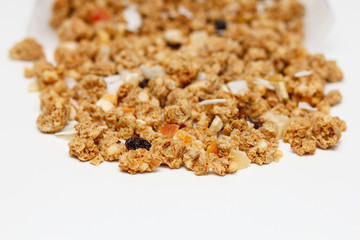 Granola with fruits and nuts. Baked muesli mix. Super food concept. Breakfast cereals. Kids diet. White isolation background.