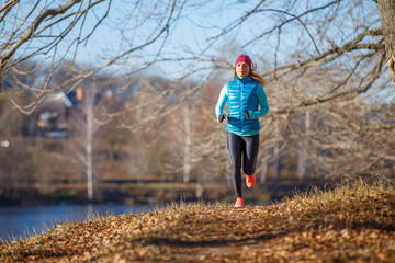 Fitness girl training running in the morning park