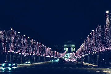 Arch of Triumph and Champs Elysees with Christmas festive illumination. Paris during winter...