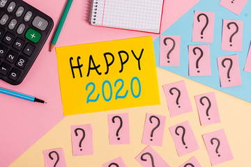Conceptual hand writing showing Happy 2020. Concept meaning time or day at which a new calendar year begin from now Mathematics stuff and writing equipment on pastel background