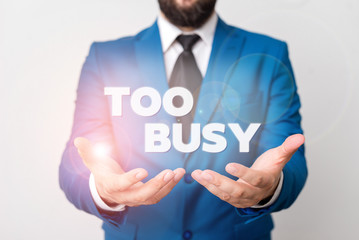 Text sign showing Too Busy. Business photo showcasing No time to relax no idle time for have so much work or things to do Man with opened hands in fron of the table. Mobile phone and notes on the