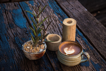 Evening sun shining coffee on an old wooden table