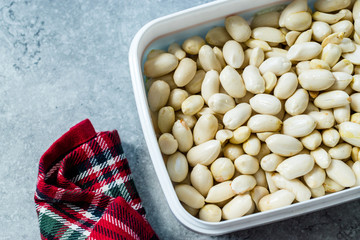 Organic Unsalted White Peeled Raw Peanuts in Plastic Box Container / Package.