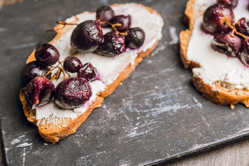 Sandwich with grilled grape and honey. Selective focus. Shallow depth of field.