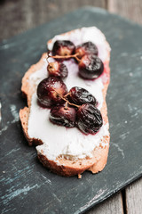 Sandwich with grilled grape and honey. Selective focus. Shallow depth of field.
