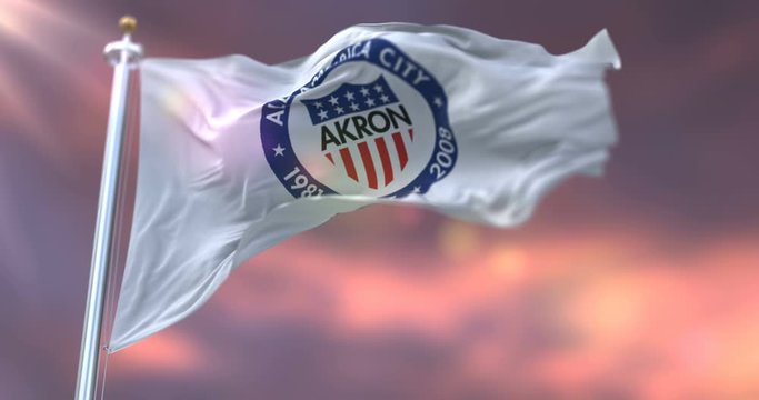 Flag of Akron city at sunset, Ohio, United States of America - loop