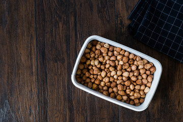 Roasted Macadamia Nuts in Plastic Box Container / Package.