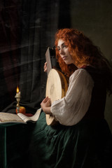 Red-haired girl in a historical suit plays the lute. Renaissance painting style.....