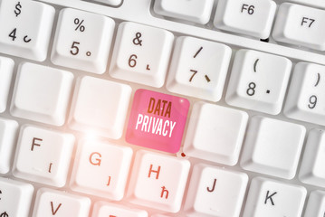 Handwriting text writing Data Privacy. Conceptual photo protection of sensitive data from unrelated third parties White pc keyboard with empty note paper above white background key copy space