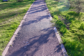 sidewalk, asphalt pavement along the road
