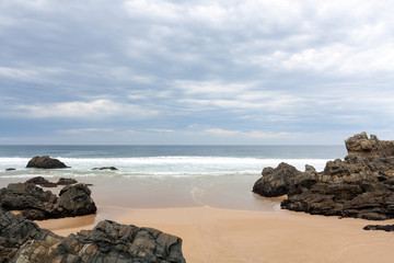 Fototapeta na wymiar View through beach with rocks