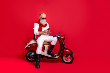 Fototapeta na wymiar Full length body size view of his he nice attractive stylish trendy confident focused gray-haired man internet online browsing free time 5g isolated over bright vivid shine red background