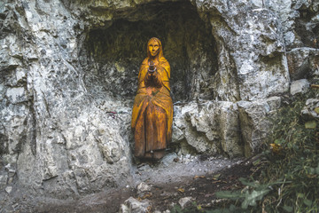 Fototapeta na wymiar Statue of the Virgin Mary in the canyon of Hornadu river, in Slovensy raj