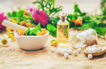 Homeopathy. Herbal extracts in small bottles. Selective focus.