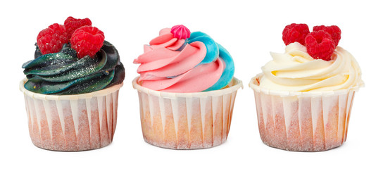 Three yummy cupcakes with icing  isolated on white background