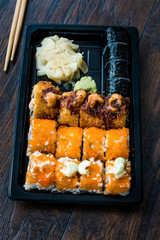Sushi Set in Plastic Container Box / Package. California Roll, New York Roll, Boom Roll, Ginger, Wasabi and Soy Sauce.