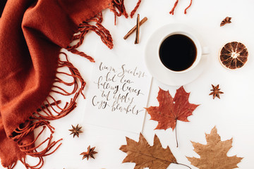 Autumn, fall composition. Modern hand made calligraphy with cup of coffee, ginger blanket, dried...
