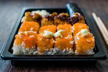 Sushi Set in Plastic Container Box / Package. California Roll, New York Roll, Boom Roll, Ginger, Wasabi and Soy Sauce.