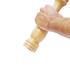 Male hand holding pepper mill isolated on white background