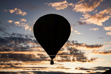 hot air balloons flying at sunset - live your dream, freedom and adrenaline concept