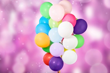 Fototapeta na wymiar Bunch of colorful balloons on pastel background