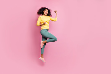 Fototapeta na wymiar Full body photo of emotional enthusiastic cheerful expressing triumph having nice mood hipster jumping up waiting for prize wear yellow sweater pants isolated pastel color background