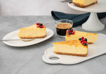Sliced cheesecake with a glass of coffee.