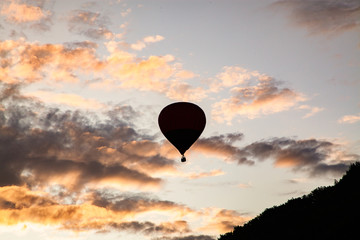 hot air balloons flying at sunset - live your dream, freedom and adrenaline concept