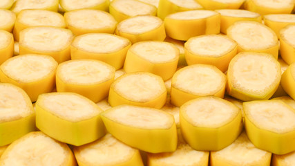 Fresh banana slices background. Top view.