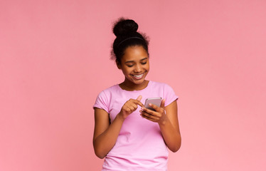 Cool Application. Interested Girl Using Smartphone on Pink Background