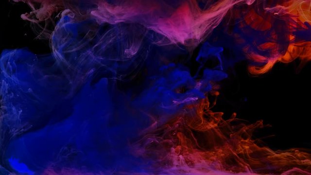Color paint drops in water , abstract  color mix , drop of Ink color mix paint falling on water Colorful ink in water,  4K footage,