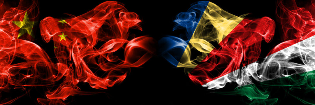 China vs Seychelles, Seychelloise smoke flags placed side by side. Thick colored silky smoke flags of Chinese and Seychelles, Seychelloise