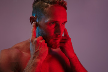 Close up portrait of a handsome fit muscular shirtless sportsman