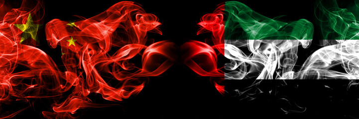 China vs United Arab Emirates, Emirati smoke flags placed side by side. Thick colored silky smoke flags of Chinese and United Arab Emirates, Emirati