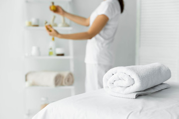 selective focus of white towel on massage mat in spa