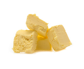 Pieces of butter isolated on white background