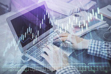 Double exposure of forex chart with man working on computer on background. Concept of market analysis.