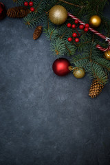 Christmas composition of fir branches, Christmas balls of red and gold and candy, pine cones.  . the view from the top . Christmas mood 2020