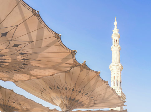 Medina, Saudi Arabia - March 22, 2018 : Exterior of Nabawi Mosque building and electronic umbrella in Medina (Madinah). Selective focus