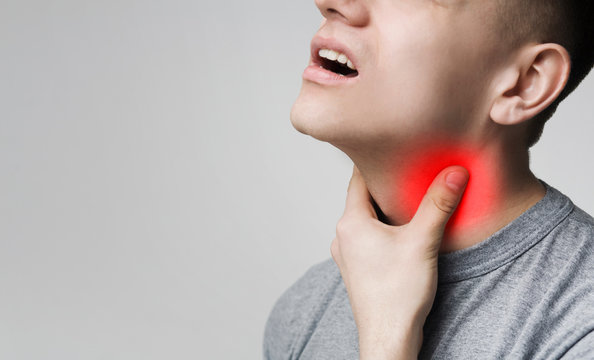 Man With Thyroid Gland Problem, Touching His Neck