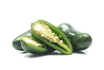 green chilies on white background (jalapeno)