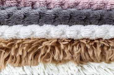 Texture fur. Warm cozy textured background with fur plaid close-up.