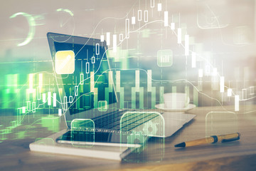 Stock market graph and table with computer background. Multi exposure. Concept of financial analysis.