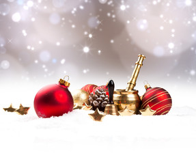 Chritsmas red ball in snow with celebration decoration. Free space for text 
