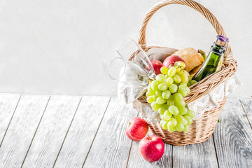 Picnic basket with fruit bread and wine