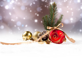 Chritsmas red ball in snow with celebration decoration. Free space for text 