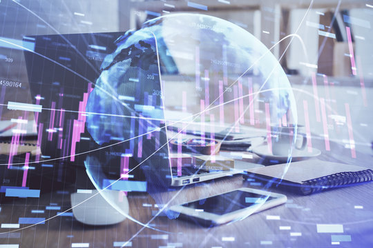 Financial graph colorful drawing and table with computer on background. Double exposure. Concept of international markets.