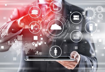 Business and technology concept. Man touching business elements on screen