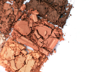 Macro texture Broken eye shadow brown powder, isolated on white background